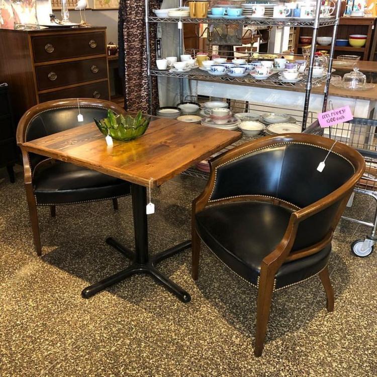 Cafe table $250. black vinyl armchairs $150 each.