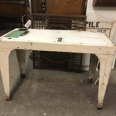 Metal table with flip up extension 35” W 16” D  22 3/4” H without extension up