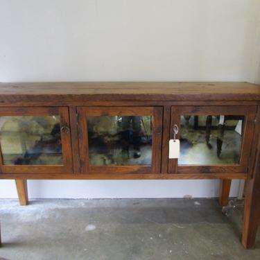 VERY LARGE RUSTIC SIDEBOARD/CREDENZA WITH ANTIQUED MIRROR INSETS