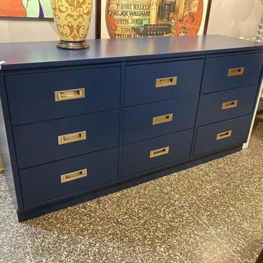Blue painted 9 drawer campaign style dresser. 61.75” x 17.75” x 30”