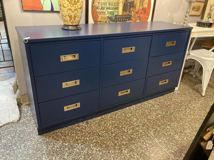 Blue painted 9 drawer campaign style dresser. 61.75” x 17.75” x 30”