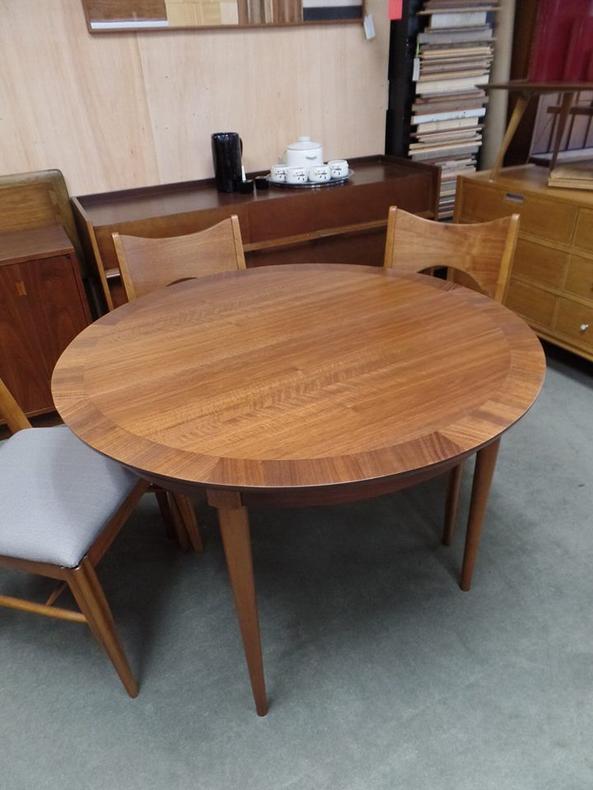 Mid-Century Modern round walnut dining table