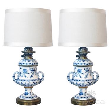 a good pair of meissen blue onion pattern oil lamps now electrified; originally sold by Whiteley's Dept. Store, London