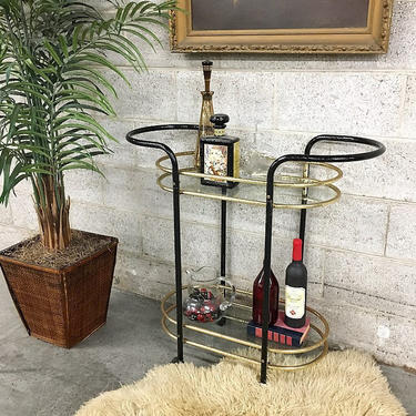 LOCAL PICKUP ONLY Vintage Bar Cart Retro 1980s Black and Gold Metal with 2 Clear Glass Shelves Rounded Frame with Handles and Wheels 