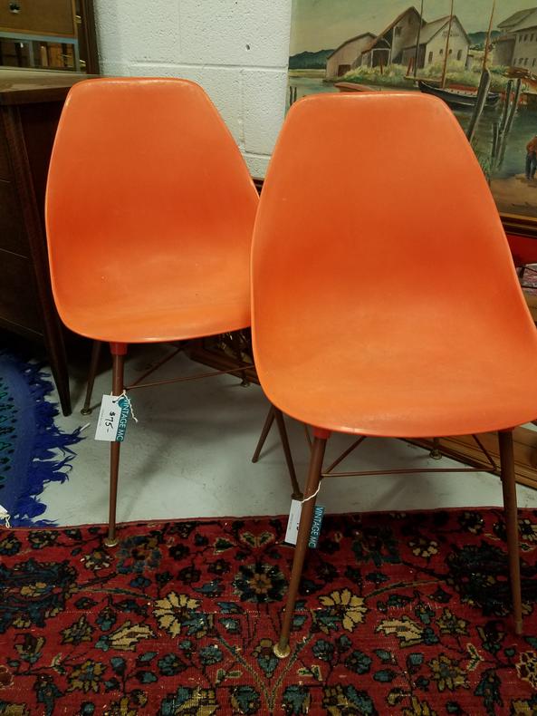 Orange plastic atomic style side chairs