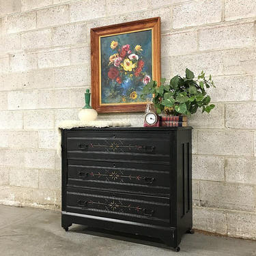 LOCAL PICKUP ONLY Vintage Wood Dresser Retro 1960's Three Drawer Black Bureau with Colorful Carved Detail Ornate Metal Hardware and Wheels 