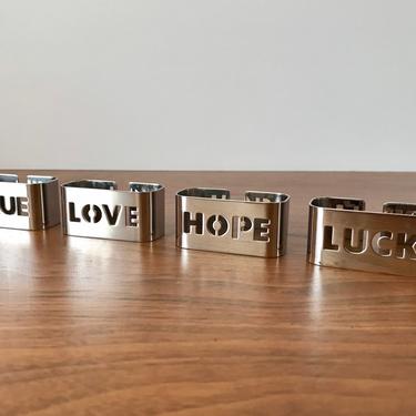 Set of 4 WMF Stainless Steel Napkin Rings by Judith Zeller - True Love Hope Luck 