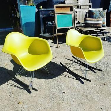 Pair of two canary yellow molded plastic rockers