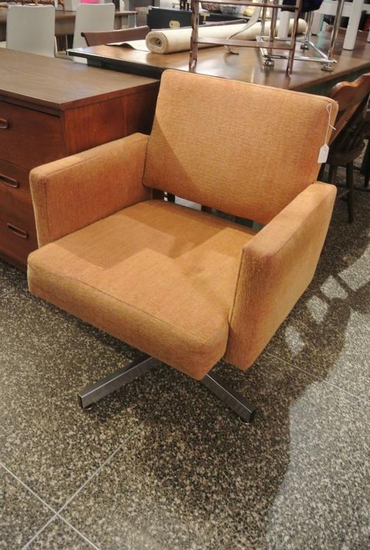Brown upholstered swivel chair