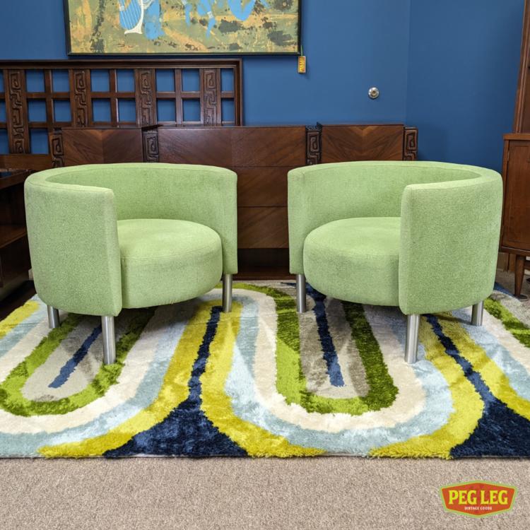 Pair of vintage barrel chairs with green upholstery