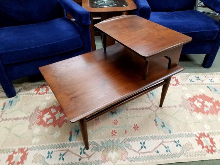 Mid-Century Modern walnut step table with curved edges