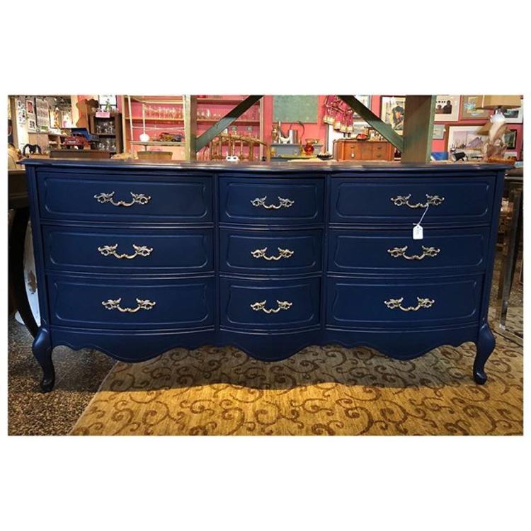 Navy blue French provincial dresser with 9 drawers. 65” long / 19” deep / 32” height 