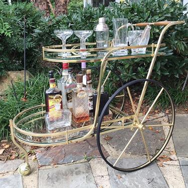 Vintage, mid-century brass bar cart. Original glass shelves are removable. Wooden and brass handle. #midcentury #vintage #retro #madmen #mocomd #olneymd #shoplocalmd #barcart