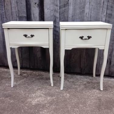 Wonderful pair of nightstands made from vintage sewing machine cabinets. A shelf inside gives you plenty of storage. 22w x 17d x 31h $300/pair