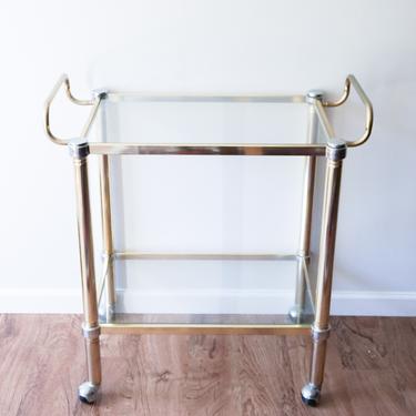 Sleek Gold Mid-Century Brass and Heavy Glass Rolling Bar Cart 