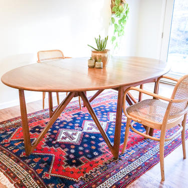 Gorgeous Authentic Danish Mid-Century Modern Solid Teak Wood Expandable Dining Table With Stunning Fold-Out Leg Design 