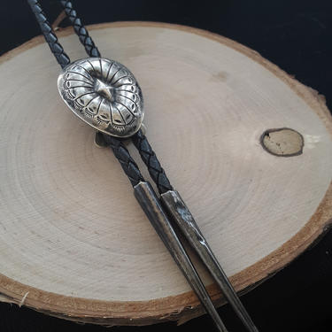 Navajo stamped bolo tie with black leather 