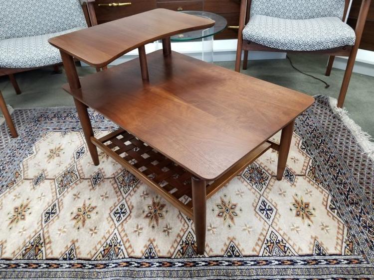 Miid-Century Modern walnut step table with woven lower shelf