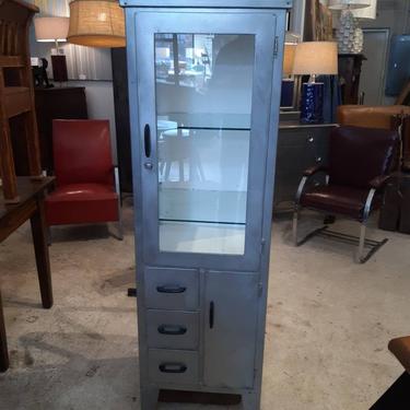 Vintage industrial stripped steel medical cabinet with adjustable shelves. 