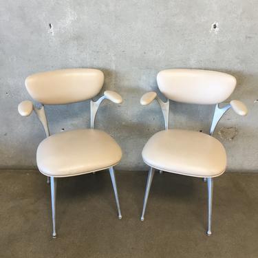 Pair of Modernica Impala series arm chairs in beige leather