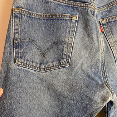 Vtg distressed 501 Levis denim jeans faded blue whiskers worn in Button fly 501’s Unisex boyfriend cut size 33” W 