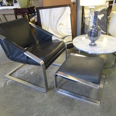 BLACK LEATHER AND ALUMINUM CHAIR AND OTTOMAN