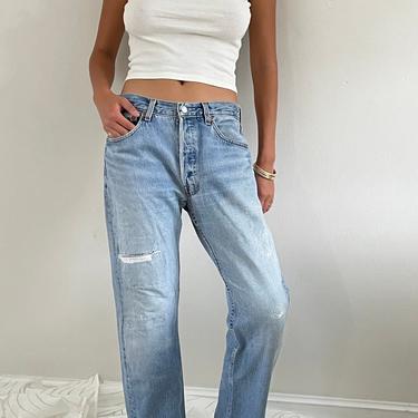 80s Levis 501 patched jeans / vintage light wash faded patched red tab relaxed boyfriend baggy slouchy button fly 501 Levis jeans | 31 W 