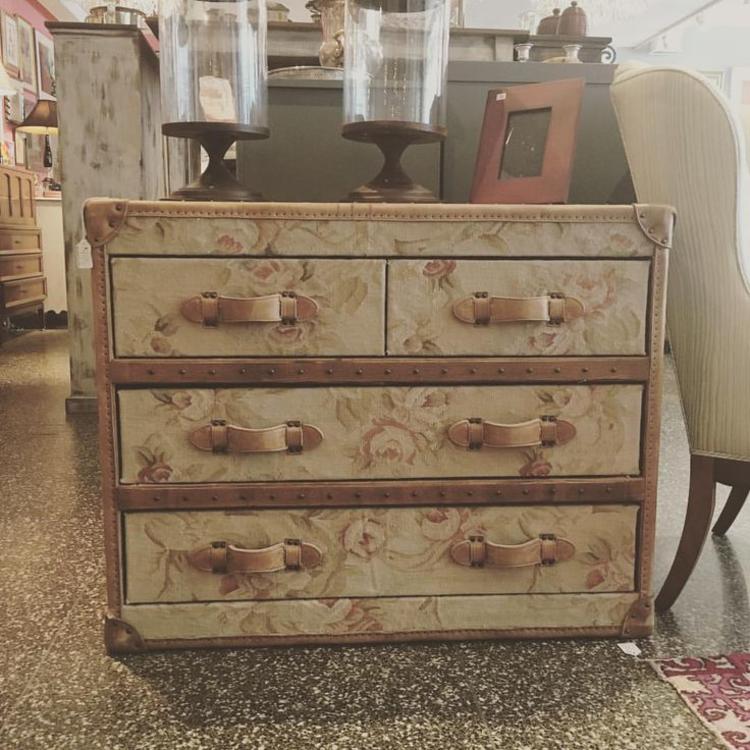 Four drawer fabric covered dresser with nailhead and leather detail. 31 inches high, 19 inches deep, 39 inches wide. $495.