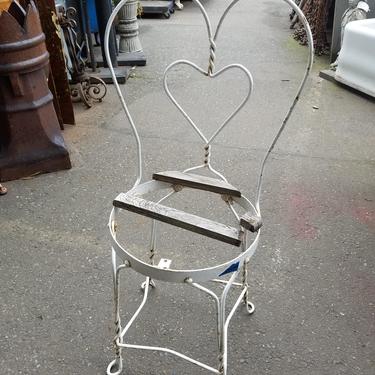 Antique wrought iron garden chair