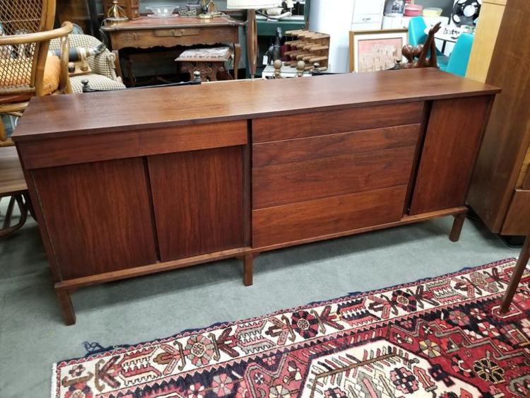                   Mid-Century Modern walnut credenza with asymmetrical fronts