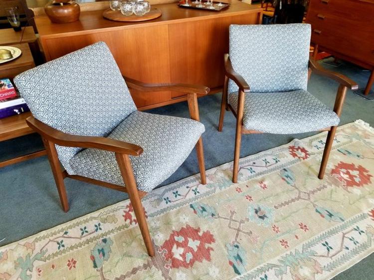 Pair of walnut arm chairs with new grey upholstery