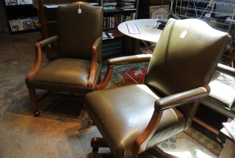 Green leather executive chairs. Two available. $75/each.