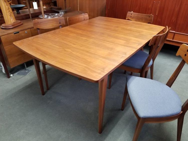Mid-Century Modern walnut dining table with two leaves from the Declaration collection by Drexel