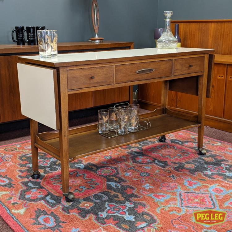 Drop-leaf rolling server/bar cart from the Sculptra collection by Broyhill