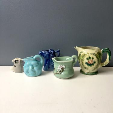 Character pitcher collection - vintage pottery group of 5 
