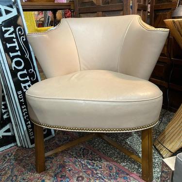Tan leather side chair with nail head accents.27.5” x 26” x 29” seat height 18”