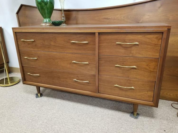                   Mid-Century Modern walnut six drawer dresser with brass pulls