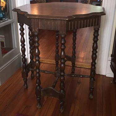 Vintage octagonal side table. Eight turned legs connected by circular stretchers. $175.  Approx 28
