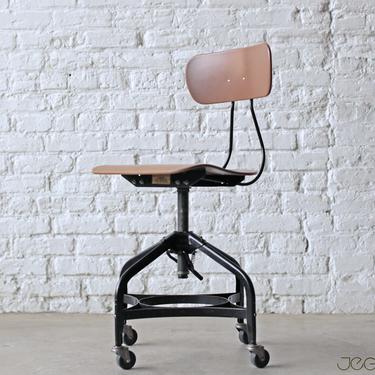 mid-century modern classic vintage height-adjustable swiveling and rolling chair by the Toledo Metal Furniture Company 