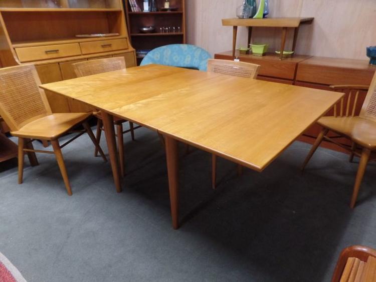 Mid-Century Modern solid birch drop-leaf dining table with two additional drop-in leaves from the Modern Mates collection by Conant Ball