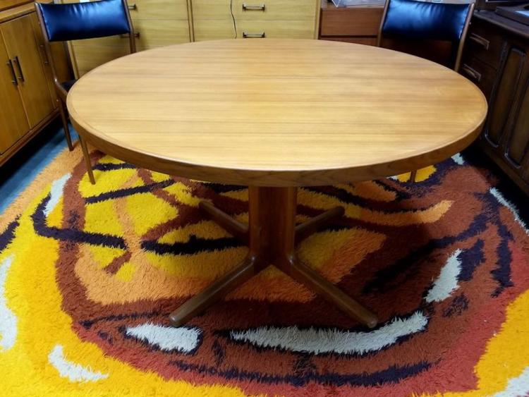 Danish Modern round teak dining table with two 20" leaves
