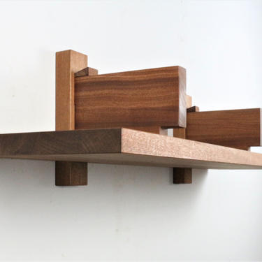 Single mahogany floating wall shelf in the style of Pierre Chapo Bibliotheque 
