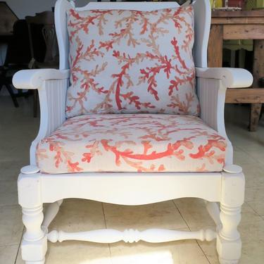 Shabby chic club chair. Painted white frame with coral print cushions. $195.