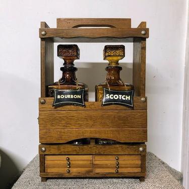 Vintage Standing Wooden Dual Decanter Holder With 8 Slide Out Coasters and Two Amber Glass Decanters 