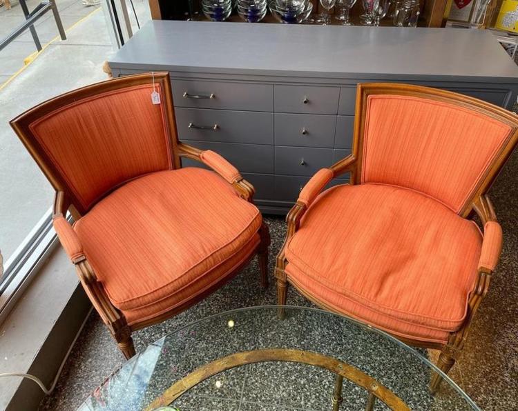 Orange upholstered armchairs 25” across 32” high 