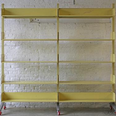 retro-yellow rolling vintage industrial cantilever massive library shelf by Estey—scalable and practical storage solution 
