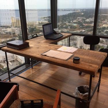L Shape desk crafted of reclaimed wood with pipe legs or square steel legs.  Choose size, finish and return side. 