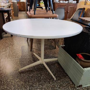 Round white laminate top table. 41