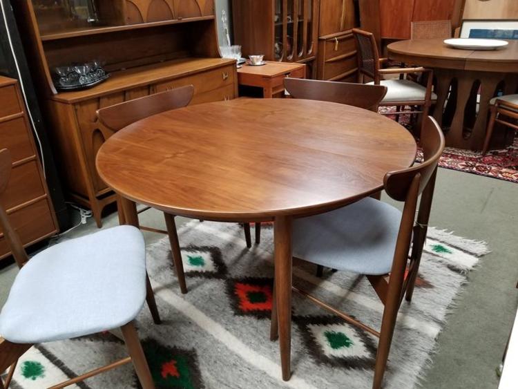 Danish Modern round walnut dining table with two 20"leaves by Skovmand and Andersen