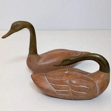 Pair of wood and brass decorative swans by Frederick Cooper 